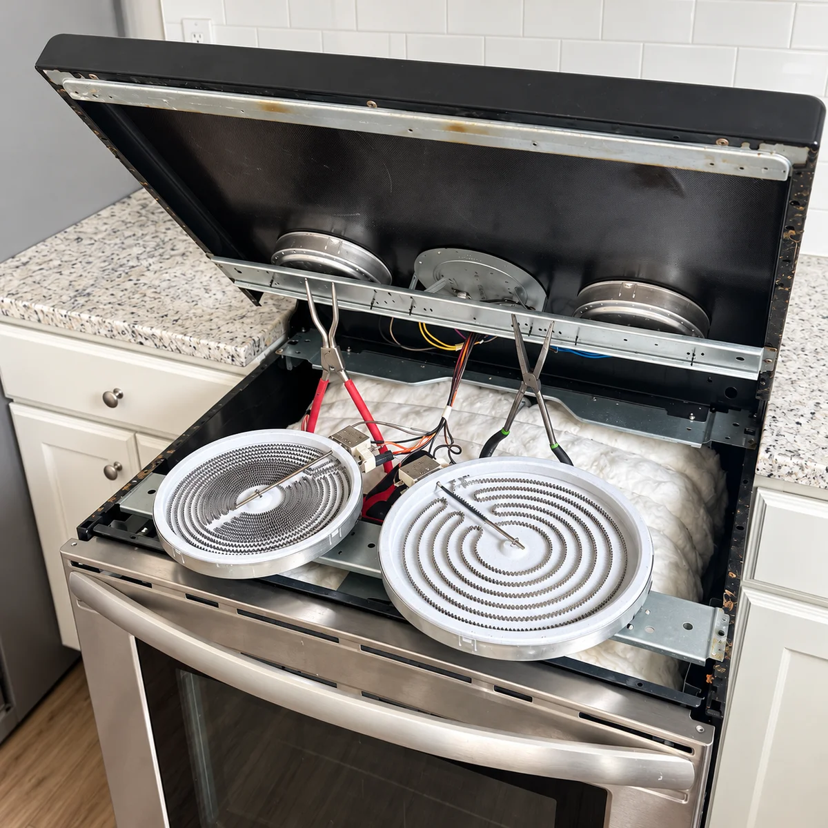 Cooktop repair technician at work