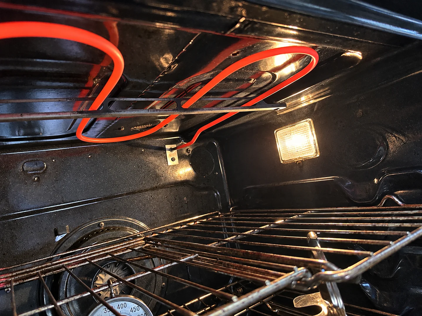 Technician repairing an oven or range in a customer's home